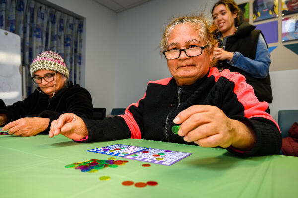 Latino seniors enjoy playing a game of bingo