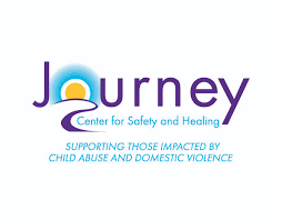 Logo for Journey Center for Safety and Healing, featuring a sunrise graphic in the letter J and text: Supporting those impacted by child abuse and domestic violence.